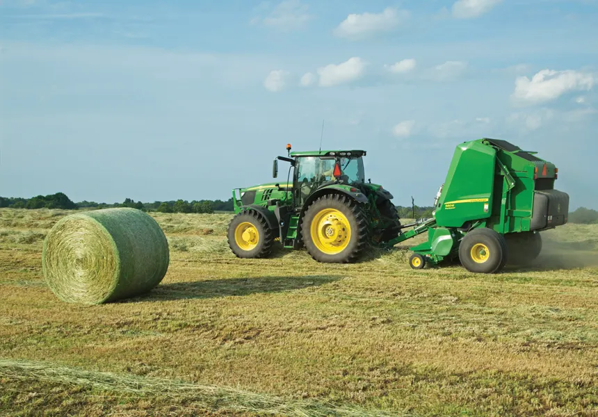 MegaRoll netwrap in action, wrapping round hay bales efficiently in the field